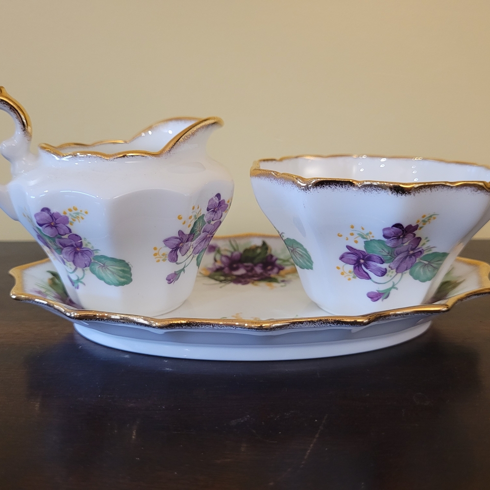 White Porcelain Creamer and Sugar Set with Purple Floral Motif and Gold Trim